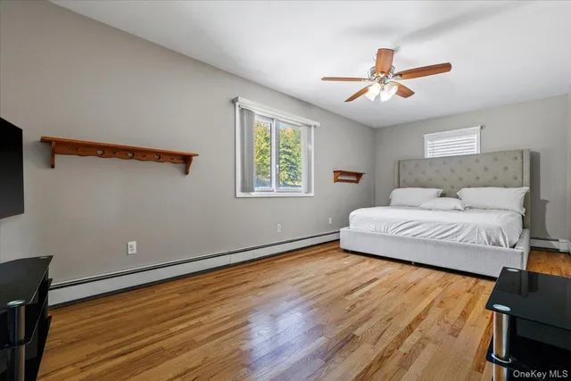 a bedroom with a large bed and a window