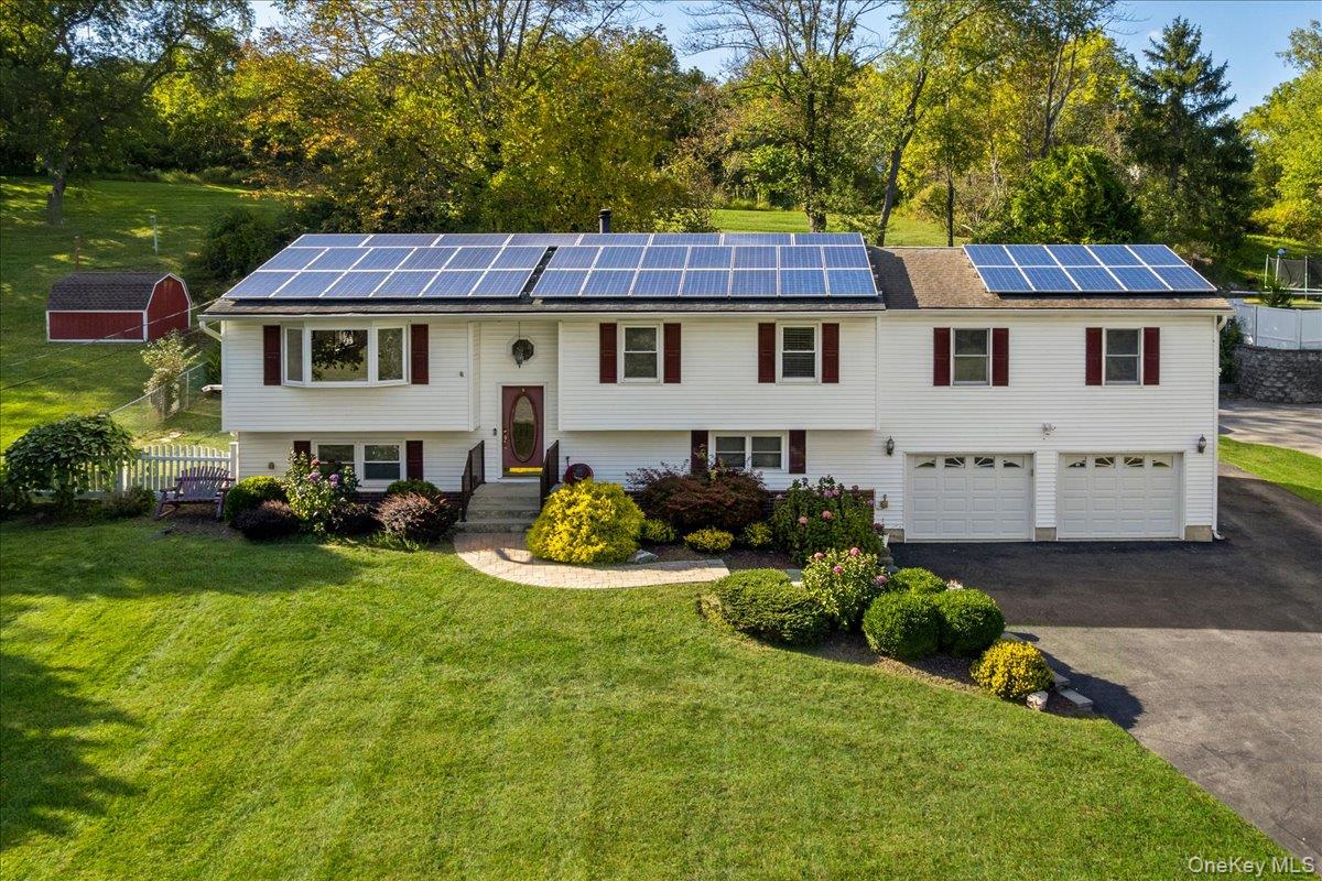 56 Daley Road Poughkeepsie, NY 12603 - Photo 2 of 35 a front view of a house with garden
