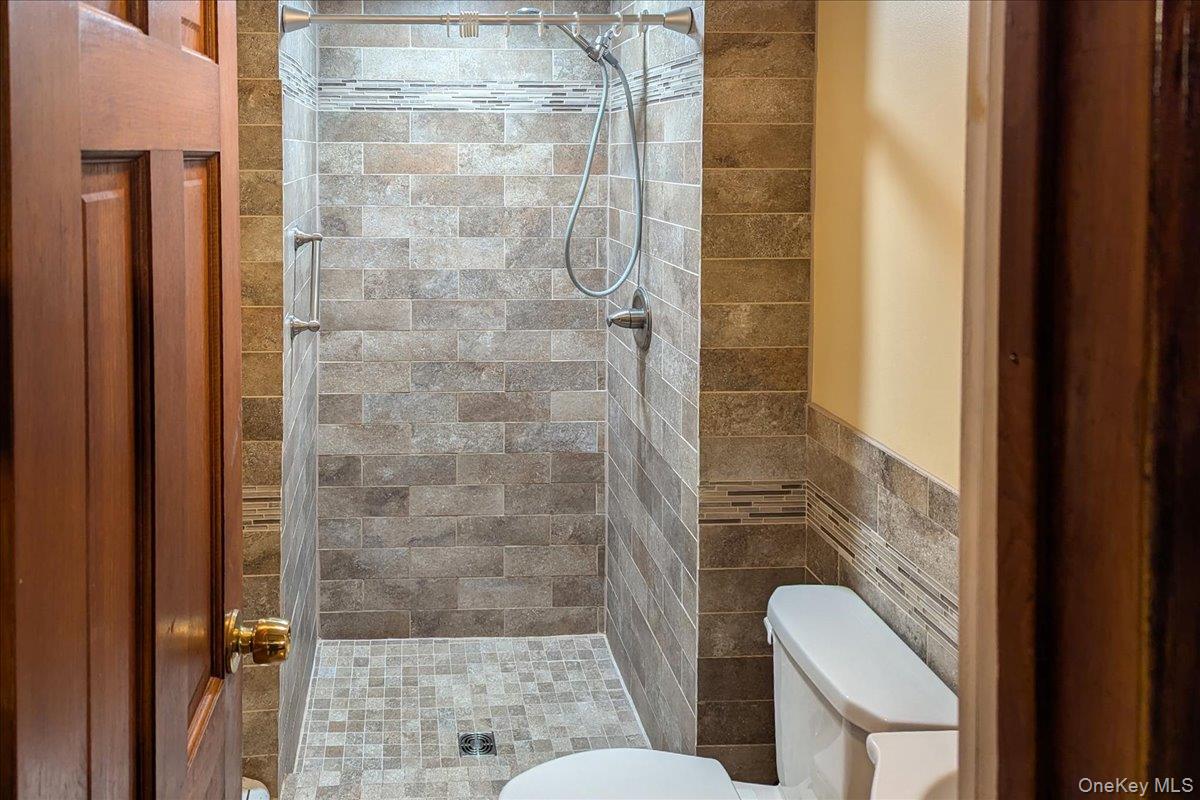 56 Daley Road Poughkeepsie, NY 12603 - Photo 27 of 35 a bathroom with a shower and toilet