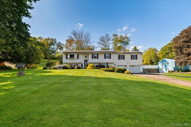 a view of a house with a big yard