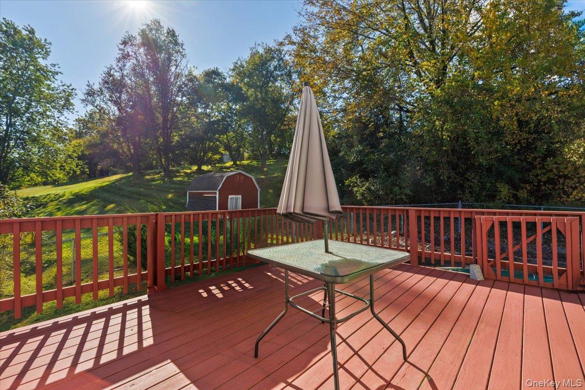 56 Daley Road Poughkeepsie, NY 12603 - Photo 30 of 35 a view of balcony with wooden floor and outdoor seating