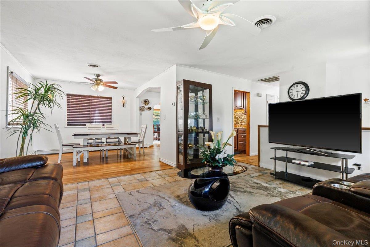 56 Daley Road Poughkeepsie, NY 12603 - Photo 7 of 35 a living room with furniture and a flat screen tv