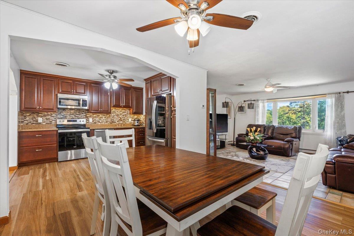 56 Daley Road Poughkeepsie, NY 12603 - Photo 10 of 35 a living room with stainless steel appliances furniture wooden floor and a kitchen view