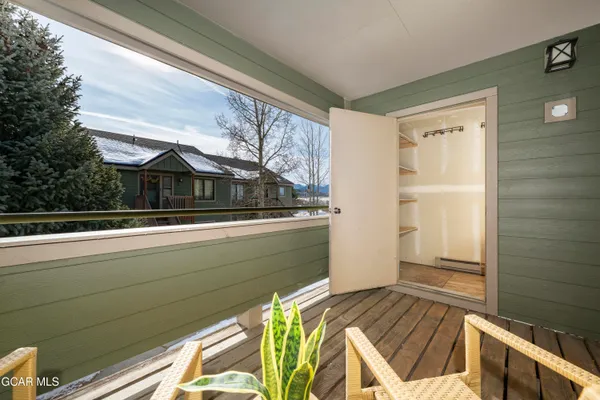 a view of balcony and two windows
