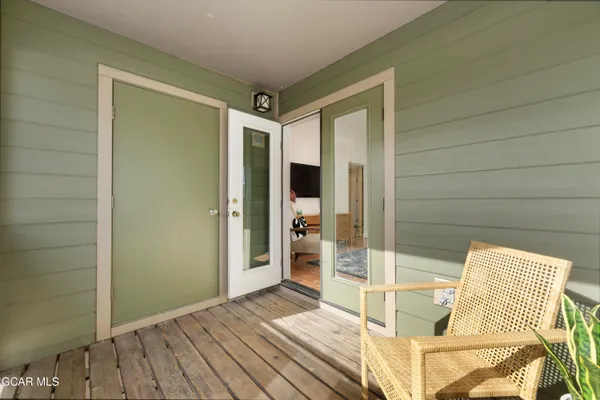 a view of a balcony with chairs