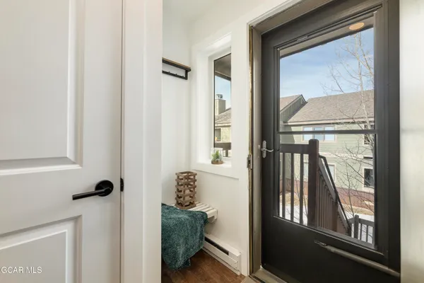 a large bed sitting in a bedroom next to a window