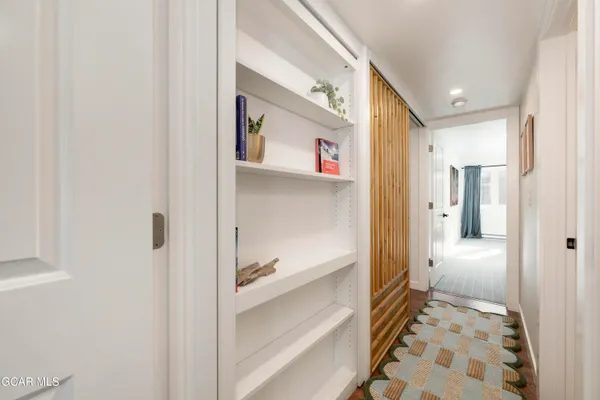 a view of a hallway with washer and dryer