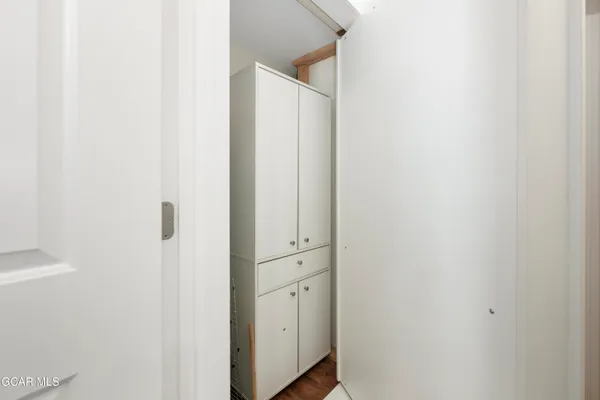 a view of a building with a tree in the background