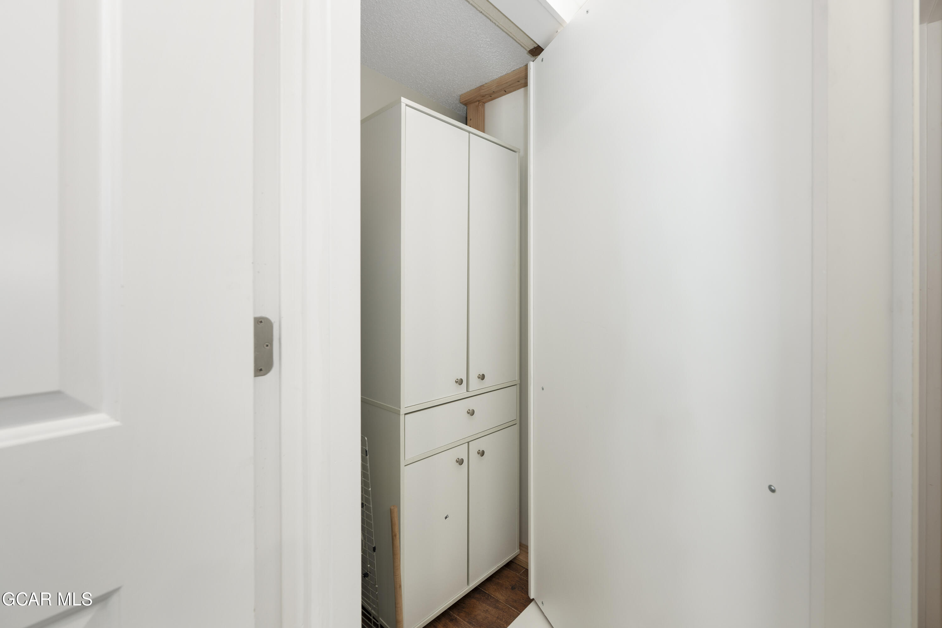 97 Doc Susie Avenue, Unit C4 Fraser, CO 80442 - Photo 31 of 36 Closet in hallway behind bookshelves