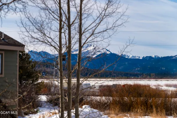 a view of a house and a yard