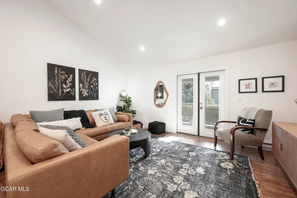 a living room with furniture or couch and a large window