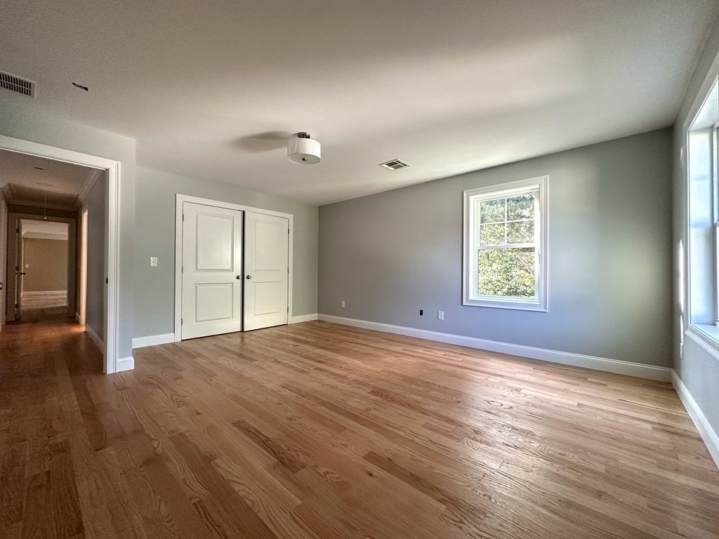 225 High Street Canton, MA 02021 - Photo 13 of 22 an empty room with wooden floor and windows