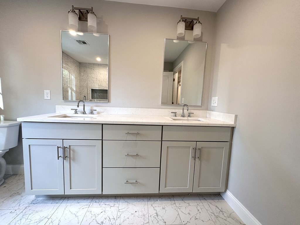 225 High Street Canton, MA 02021 - Photo 17 of 22 a bathroom with a sink vanity and mirror