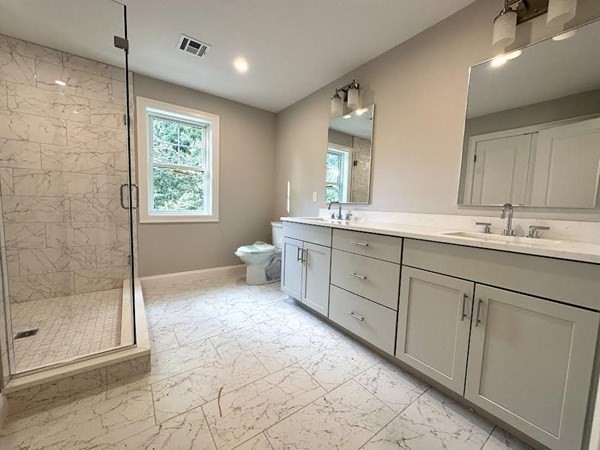 225 High Street Canton, MA 02021 - Photo 18 of 22 a spacious bathroom with a double vanity sink a mirror and a shower