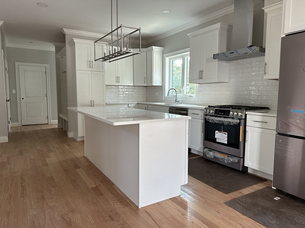225 High Street Canton, MA 02021 - Photo 4 of 22 a kitchen with a stove top oven and refrigerator