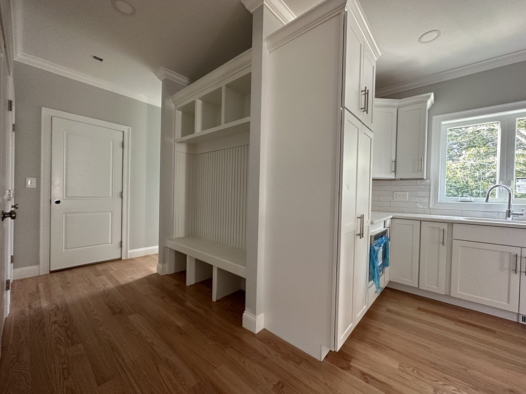 225 High Street Canton, MA 02021 - Photo 7 of 22 a view of kitchen with wooden floor electronic appliances and window