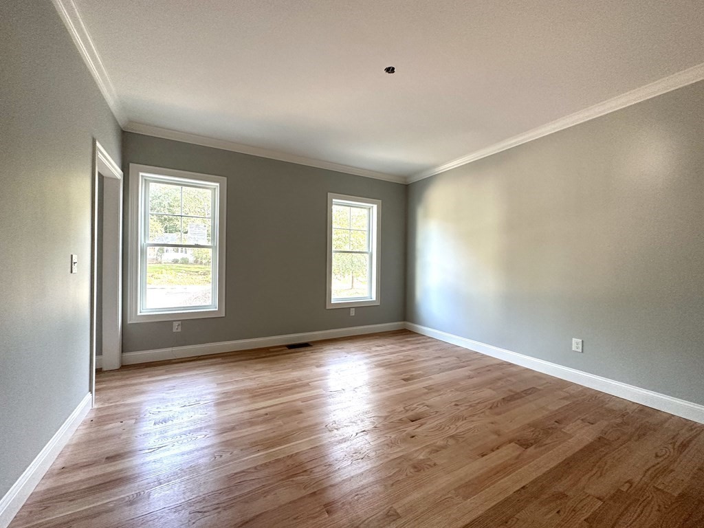 225 High Street Canton, MA 02021 - Photo 8 of 22 an empty room with wooden floor and windows