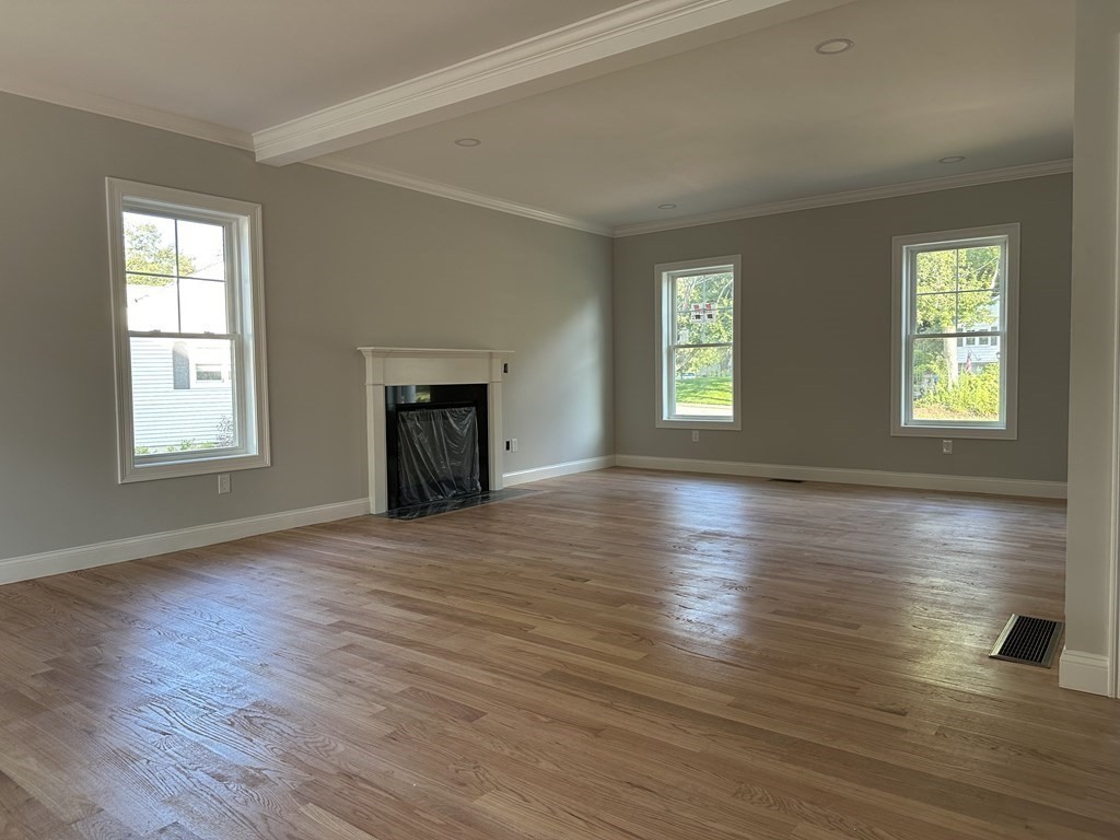 225 High Street Canton, MA 02021 - Photo 9 of 22 an empty room with wooden floor and windows