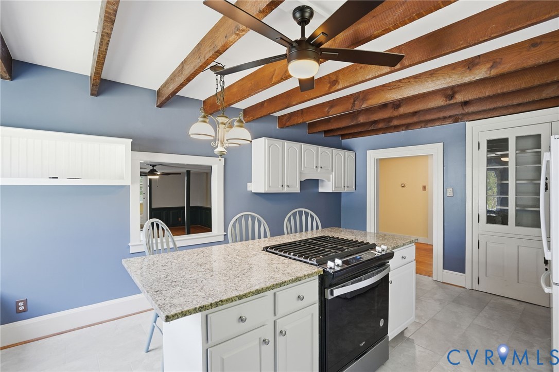 2297 Indian Oak Road Crewe, VA 23930 - Photo 19 of 53 a kitchen with stainless steel appliances granite countertop a sink stove and cabinets