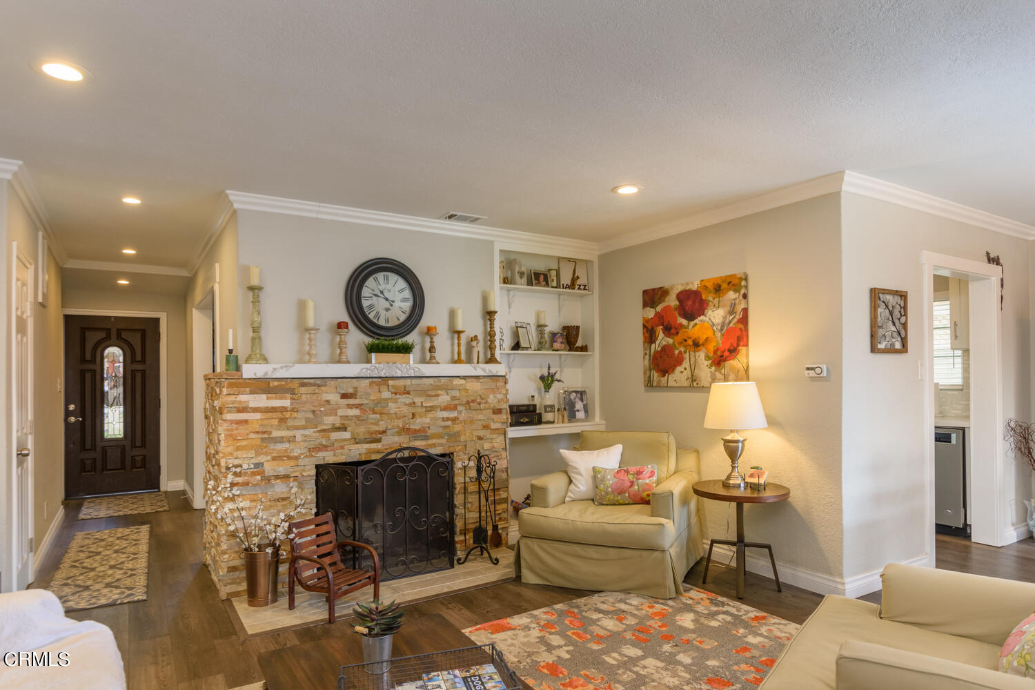 612 West Roderick Avenue Oxnard, CA 93030 - Photo 11 of 26 a living room with furniture a fireplace and a table