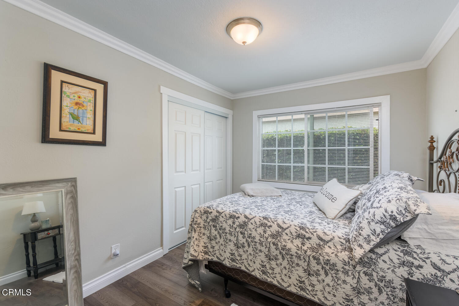 612 West Roderick Avenue Oxnard, CA 93030 - Photo 15 of 26 a large bed sitting in a bedroom next to a window