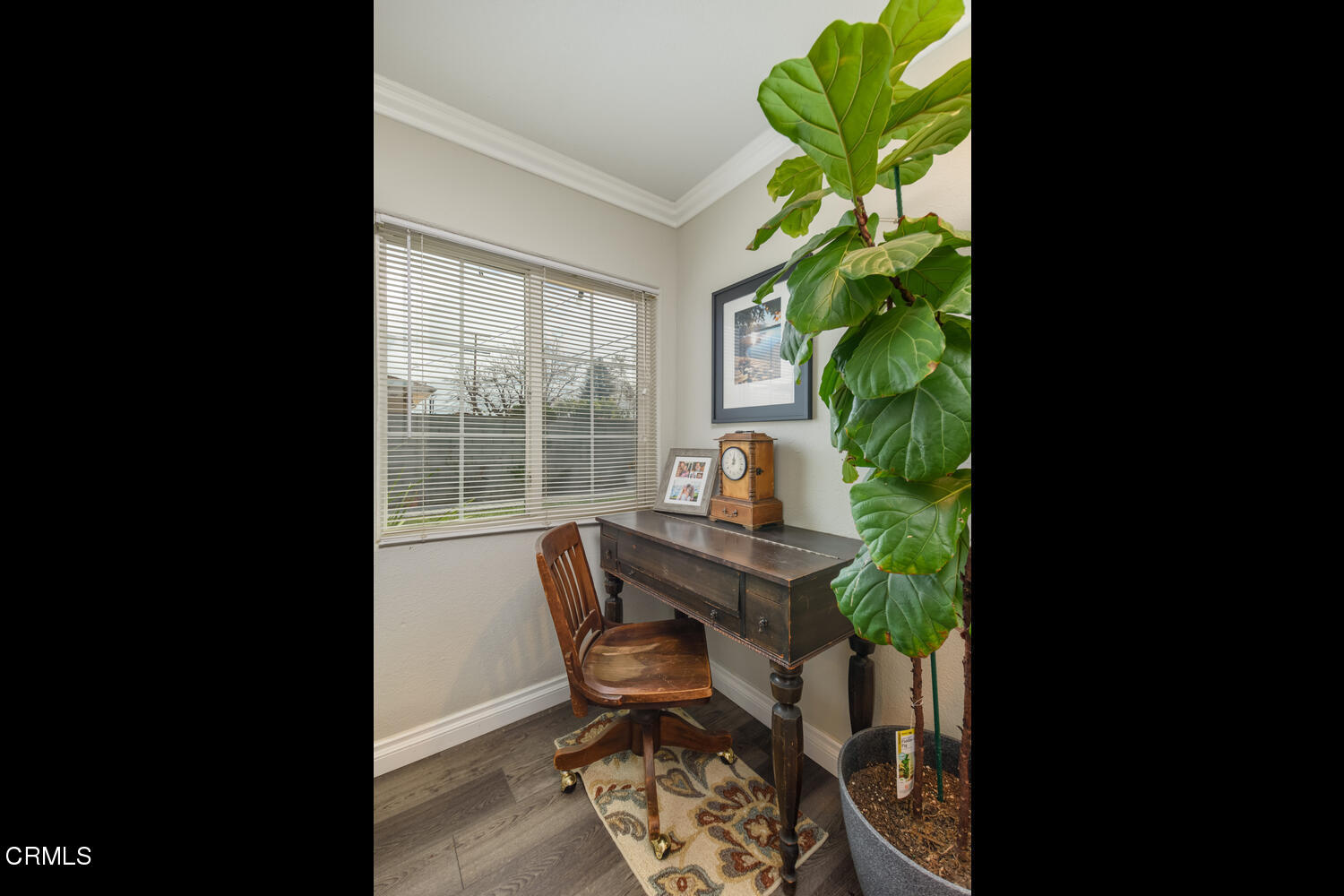 612 West Roderick Avenue Oxnard, CA 93030 - Photo 17 of 26 a view of a workspace with furniture and a potted plant