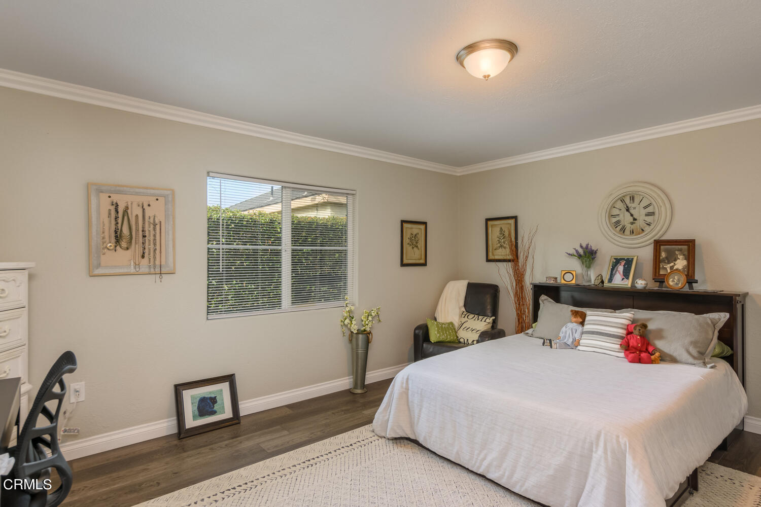 612 West Roderick Avenue Oxnard, CA 93030 - Photo 19 of 26 a bedroom with a bed and wooden floor