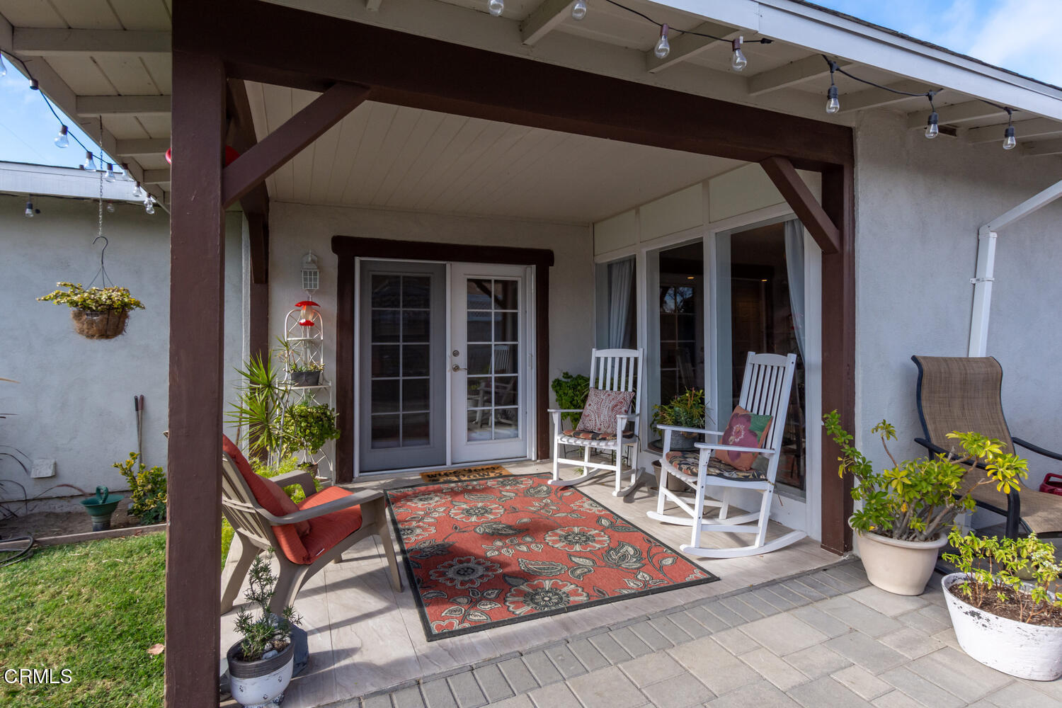 612 West Roderick Avenue Oxnard, CA 93030 - Photo 21 of 26 a view of a porch with chairs and potted plants
