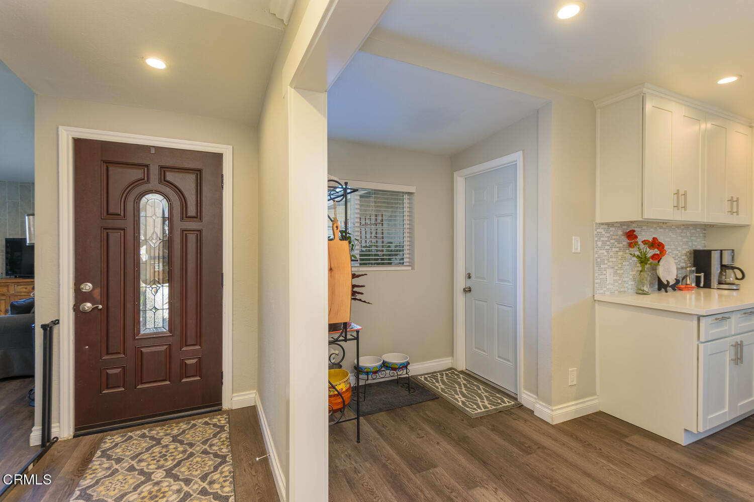 612 West Roderick Avenue Oxnard, CA 93030 - Photo 4 of 26 a view of a livingroom with wooden floor and a cabinet