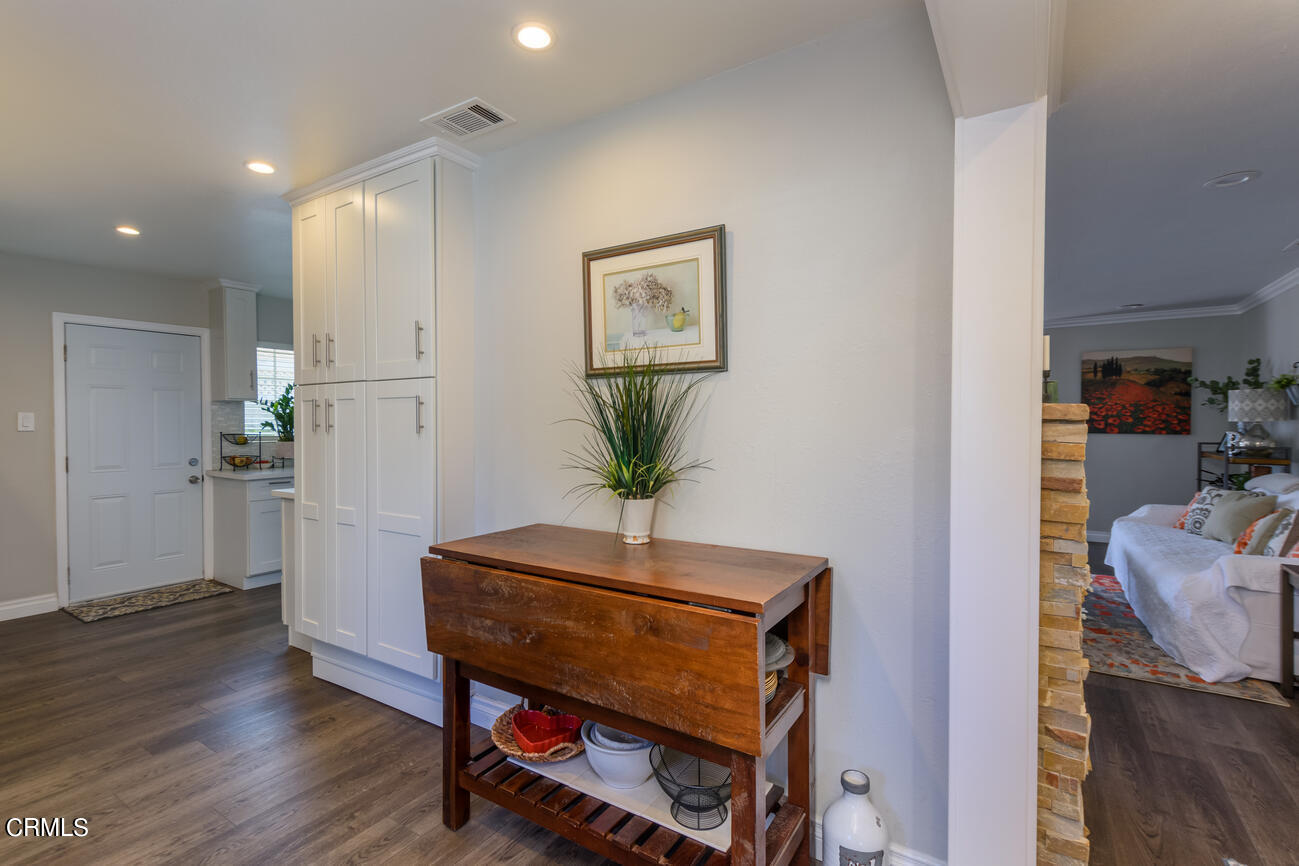 612 West Roderick Avenue Oxnard, CA 93030 - Photo 7 of 26 a view of a hallway with workspace and a potted plant