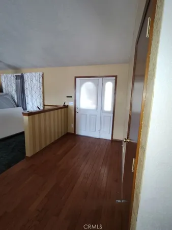 a kitchen with counter top space and living room