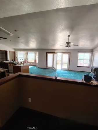 a view of an empty room with closet area