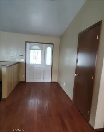 an empty room with windows and yard