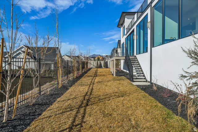 2152 South 30 West Orem, UT 84058 - Photo 55 of 56 Fenced backyard featuring stairway and a residential view
