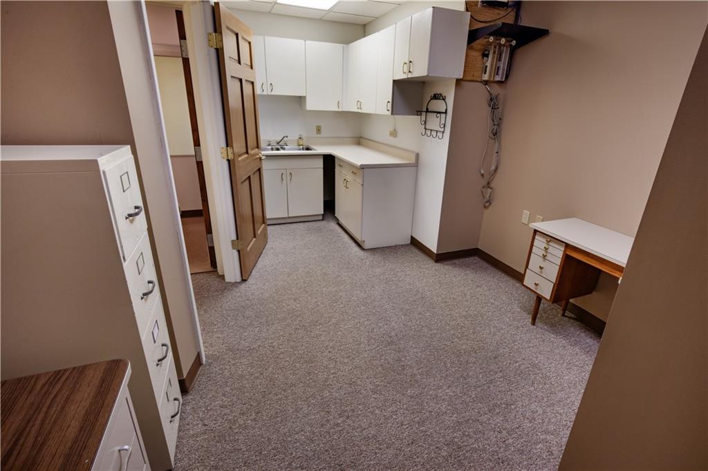 302 9th Street New Brighton, PA 15066 - Photo 13 of 16 a view of a kitchen with refrigerator and a sink
