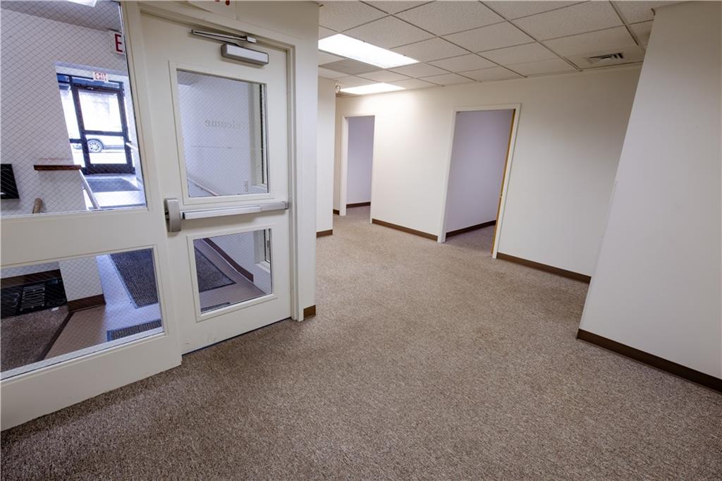302 9th Street New Brighton, PA 15066 - Photo 7 of 16 a view of a livingroom with wooden floor and cabinet
