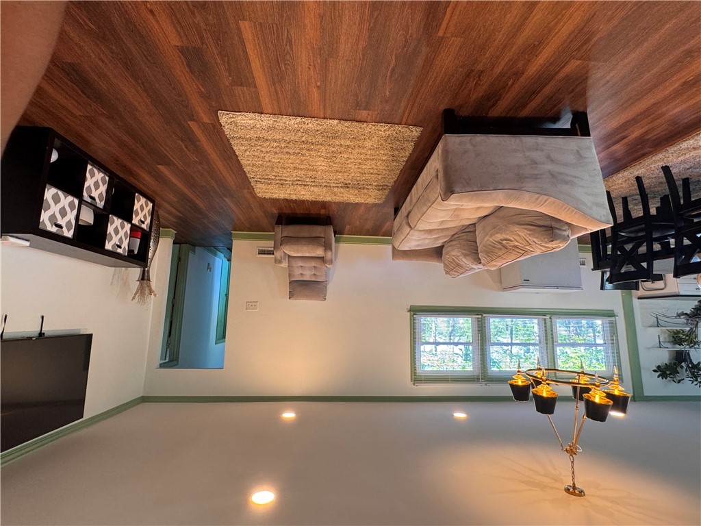 2211 East River Street Anderson, SC 29621 - Photo 12 of 40 This inviting living area boasts rich wood flooring and ample natural light, creating a comfortable ambiance.