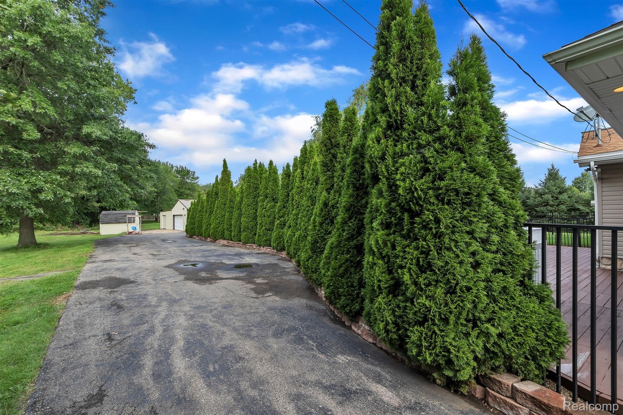 19450 Inkster Road Romulus, MI 48174 - Photo 5 of 60 SIDE DRIVEWAY LEADS TO POLE BARN
