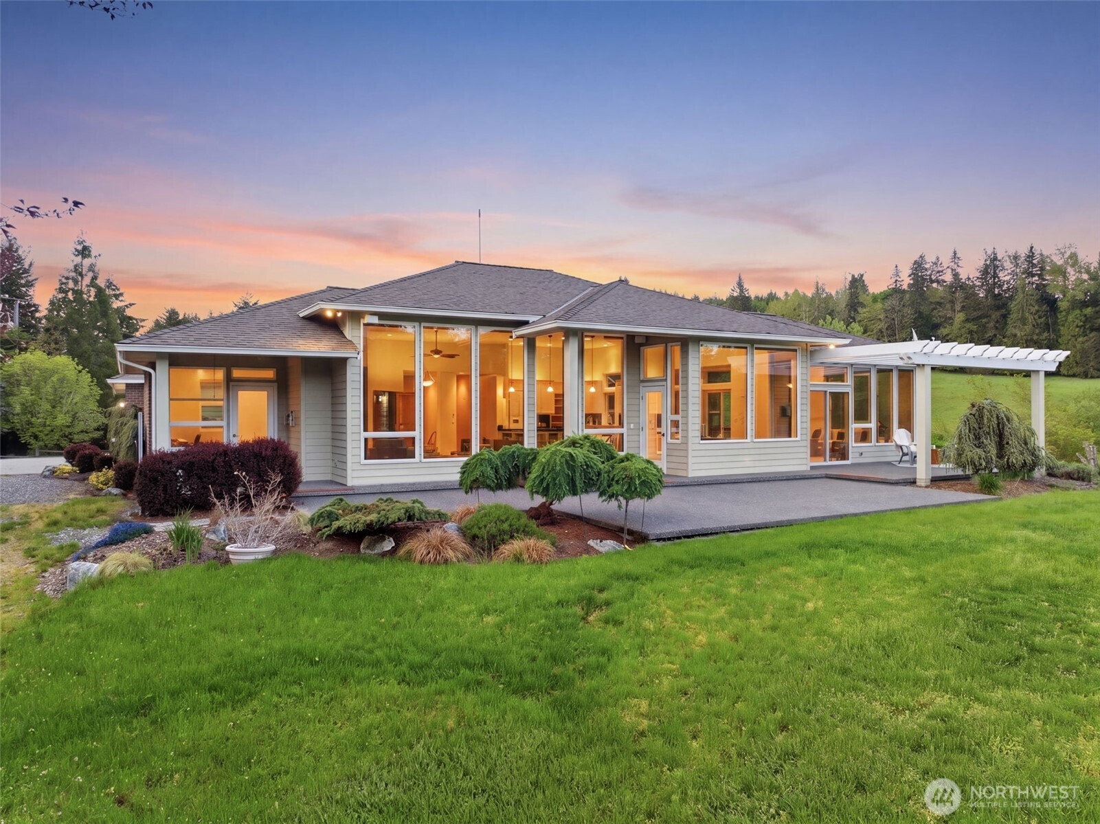 2263 Lost Mountain Road Sequim, WA 98382 - Photo 3 of 40 a front view of a house with a yard