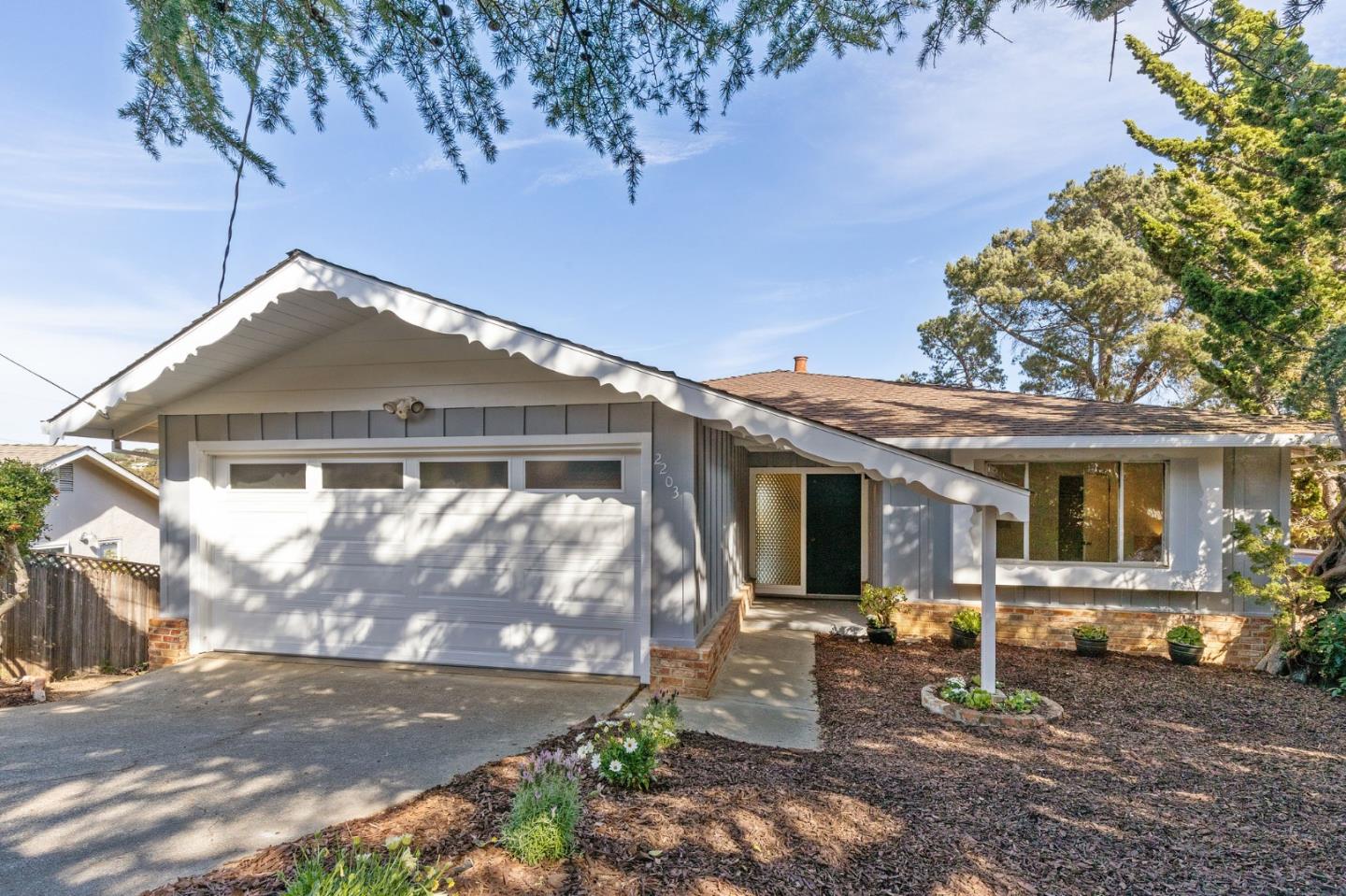 2203 Ewell Road Belmont, CA 94002 - Photo 1 of 50 a front view of a house with garden