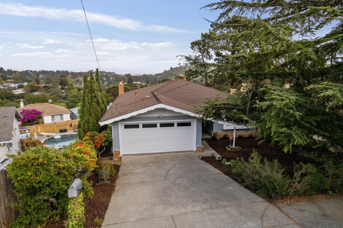 2203 Ewell Road Belmont, CA 94002 - Photo 2 of 50 a house view with a garden space