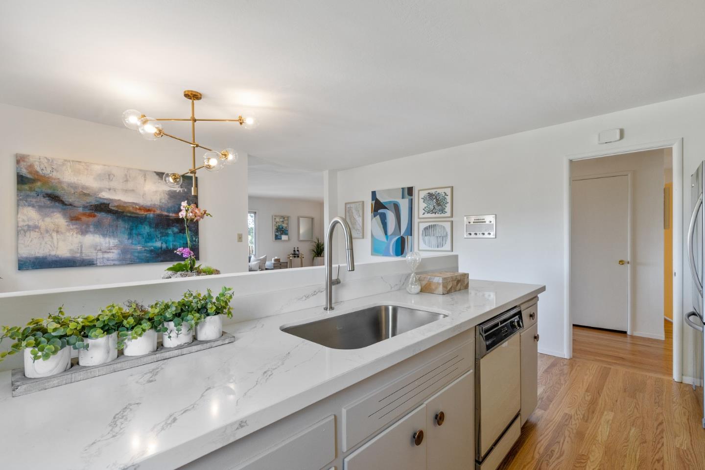 2203 Ewell Road Belmont, CA 94002 - Photo 11 of 50 a kitchen that has a sink and a stove