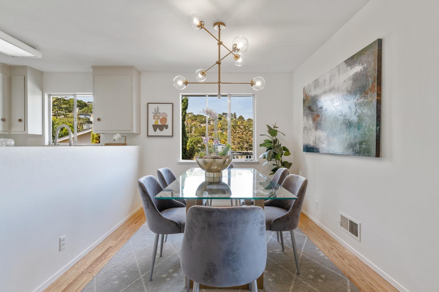2203 Ewell Road Belmont, CA 94002 - Photo 15 of 50 a view of a dining room with furniture a chandelier and wooden floor