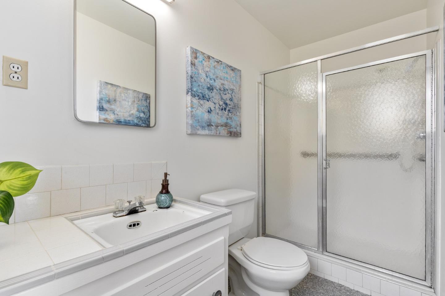 2203 Ewell Road Belmont, CA 94002 - Photo 25 of 50 a bathroom with a sink a toilet and shower
