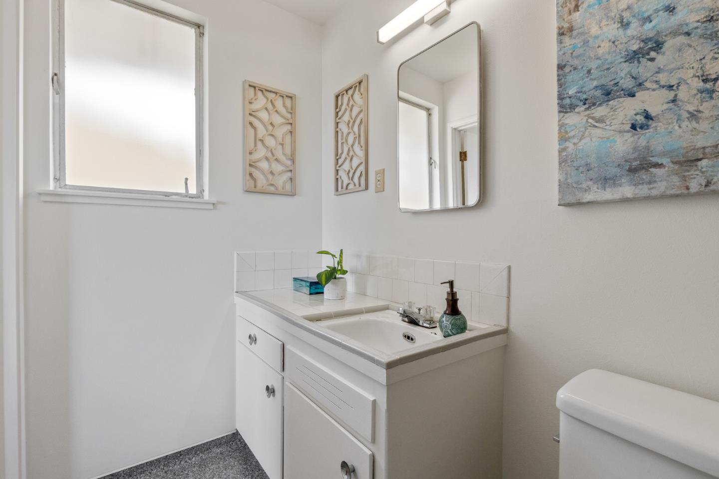 2203 Ewell Road Belmont, CA 94002 - Photo 26 of 50 a view of bathroom with a sink and a toilet