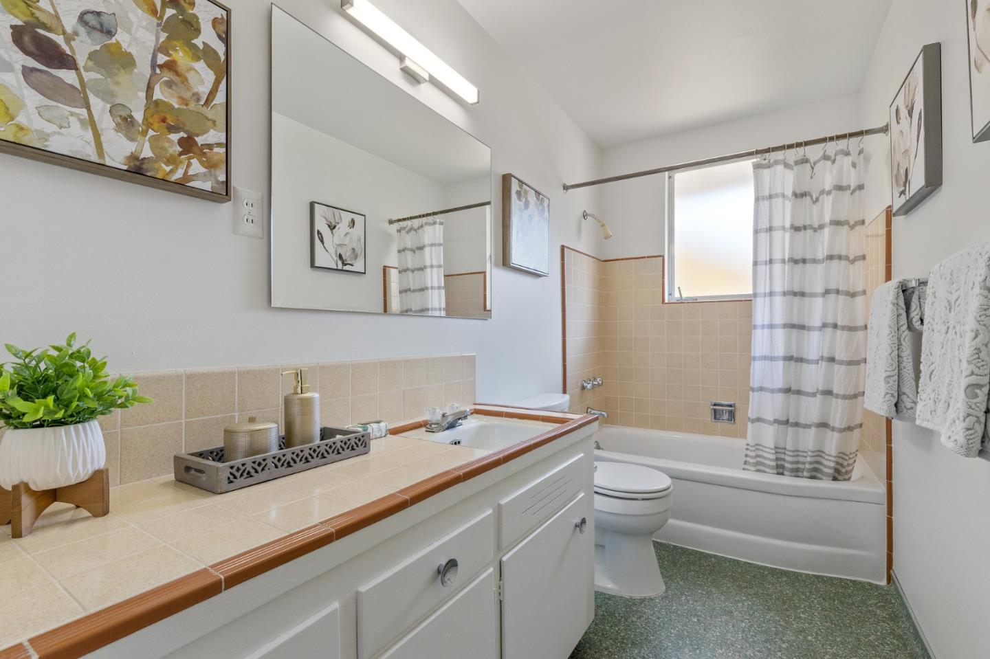 2203 Ewell Road Belmont, CA 94002 - Photo 30 of 50 a bathroom with a sink a toilet and shower