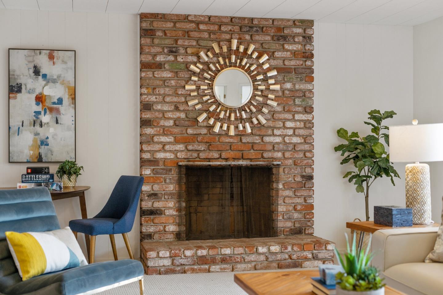 2203 Ewell Road Belmont, CA 94002 - Photo 34 of 50 a living room with furniture potted plant and a fireplace