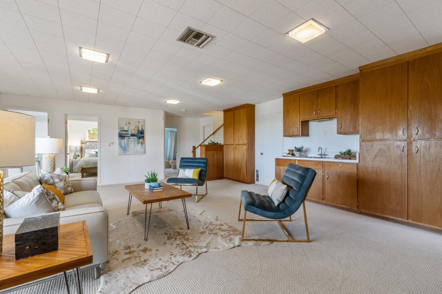 2203 Ewell Road Belmont, CA 94002 - Photo 35 of 50 a living room with furniture and kitchen view