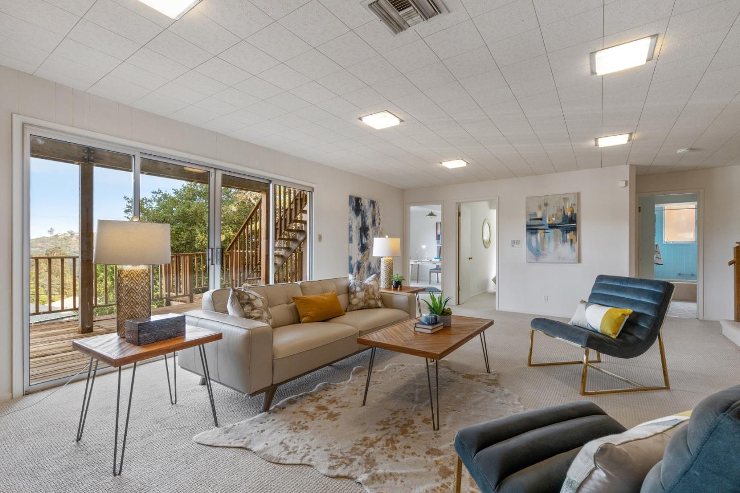 2203 Ewell Road Belmont, CA 94002 - Photo 36 of 50 a living room with furniture and a large window