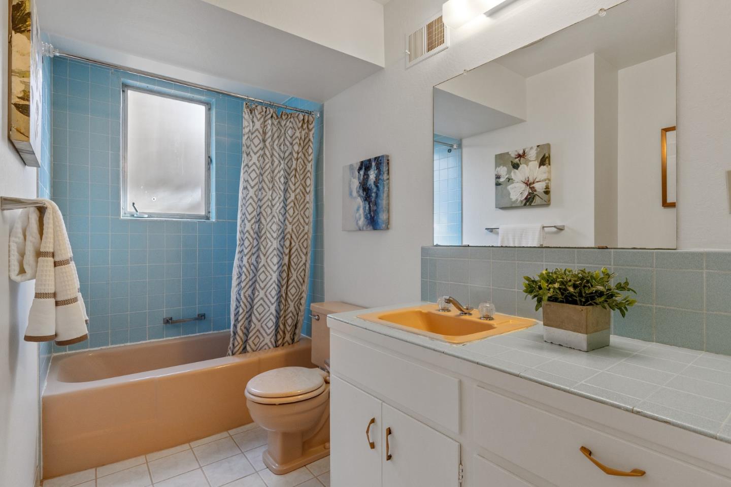 2203 Ewell Road Belmont, CA 94002 - Photo 43 of 50 a bathroom with a sink a toilet and a bathtub